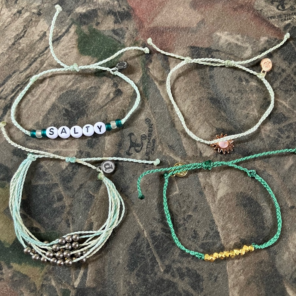 Pura vida green and gold bracelets